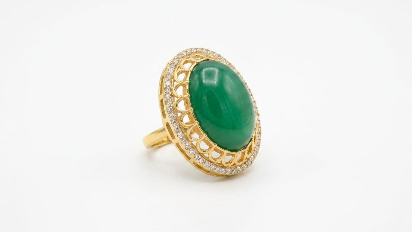 Emerald green oval stone gold statement ring in a luxury green velvet gift box with eucalyptus and candles – AureliaBlends bridal jewelry