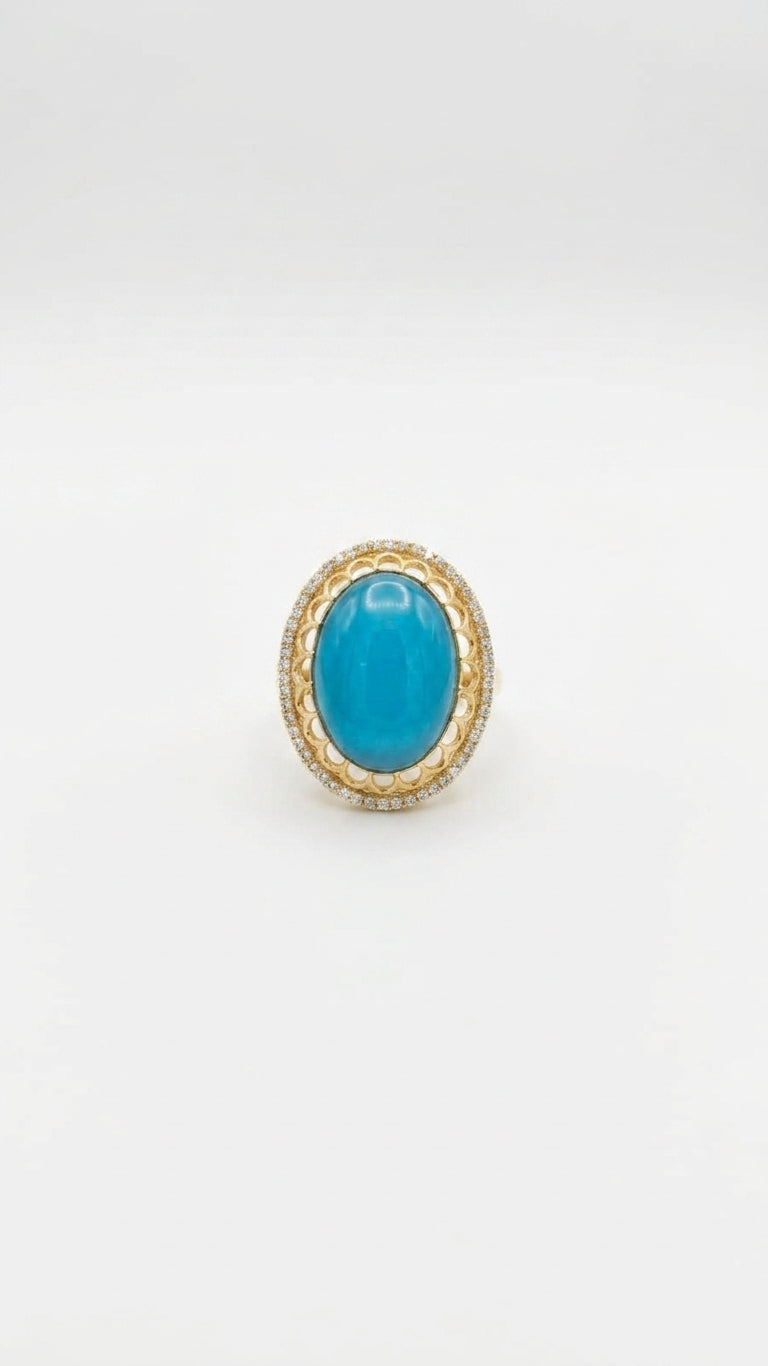 Turquoise oval cabochon stone gold-plated statement ring with cubic zirconia pavé halo on white background – AureliaBlends