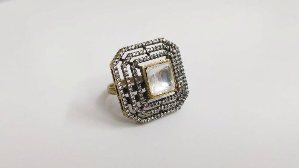 Crystal square stone gold-plated statement ring on white background showing multi-row cubic zirconia pavé halo and octagonal frame – AureliaBlends