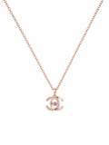 Rose gold CZ double-C interlocking pendant necklace on white background – AureliaBlends
