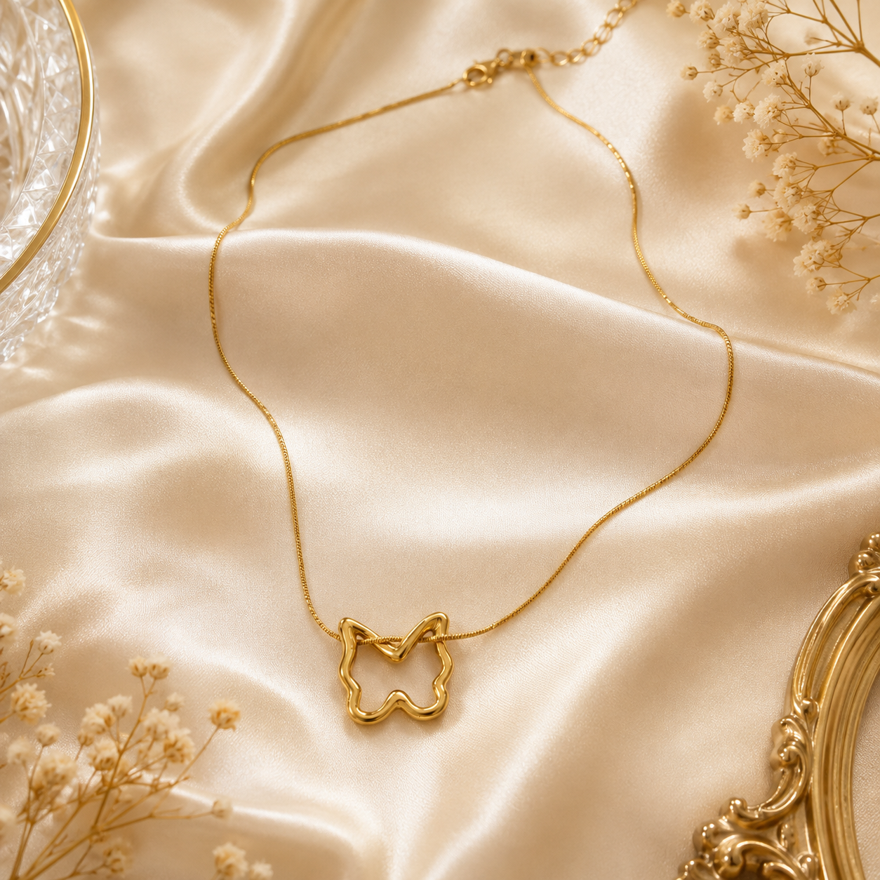 Woman wearing gold open butterfly outline pendant necklace on box chain at collarbone – dainty gold necklace for women