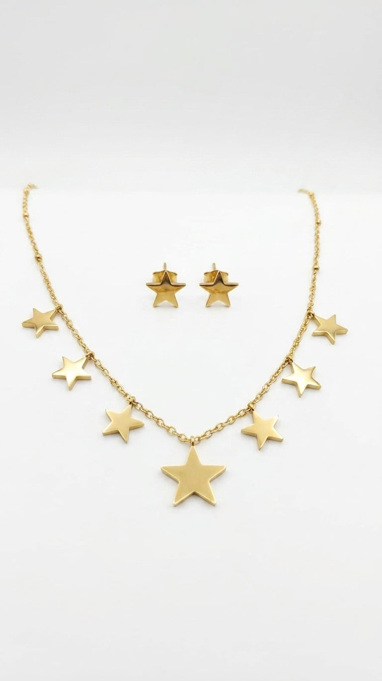 Gold multi-star dangle necklace and star stud earrings set flatlay on cream satin with baby's breath and pink velvet ribbon – AureliaBlends star jewelry set gift for her