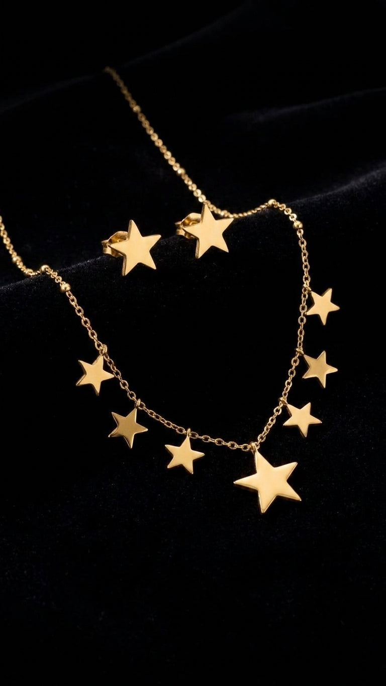 Gold star charm necklace and stud earrings set on dark velvet jewelry display – celestial gold jewelry set gift for her UK Australia