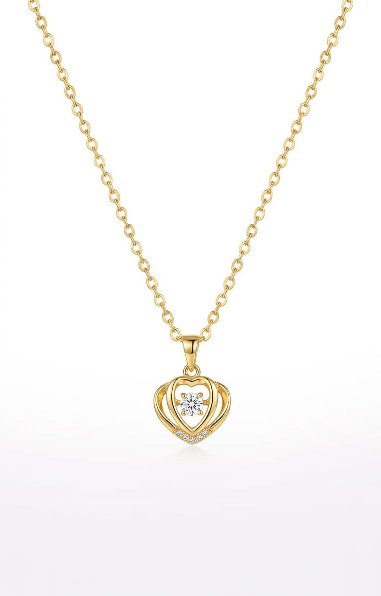 Gold CZ crown heart pendant necklace on black jewelry bust with colourful silk saree backdrop – AureliaBlends UAE bridal jewelry