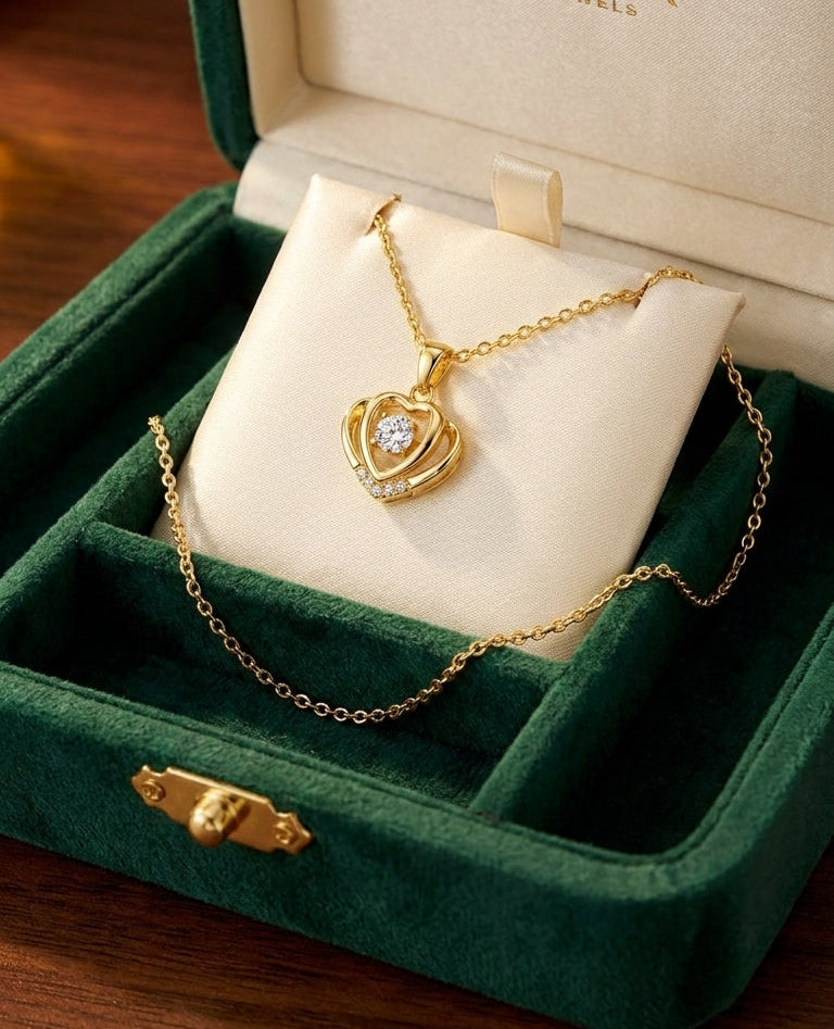 Gold crown heart CZ pendant necklace displayed in luxury glass showcase in premium jewelry boutique – AureliaBlends