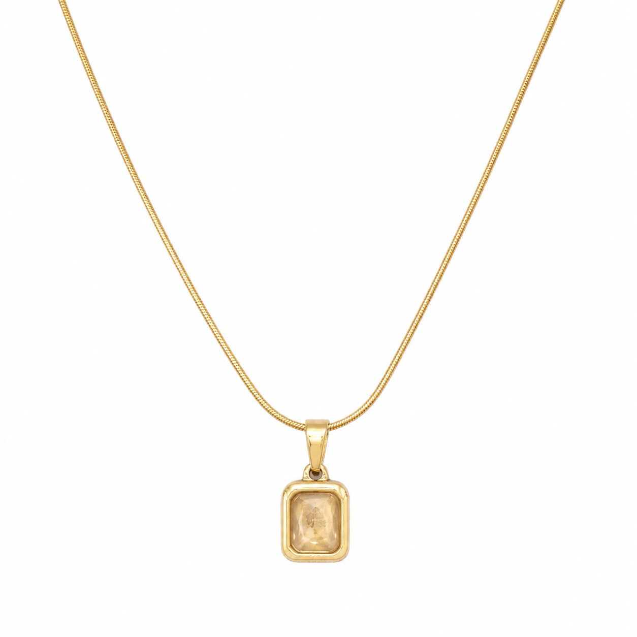 Gold bezel-set champagne crystal rectangle pendant necklace on snake chain flatlay on cream satin with dried baby's breath and gold ornate mirror – AureliaBlends gift for her