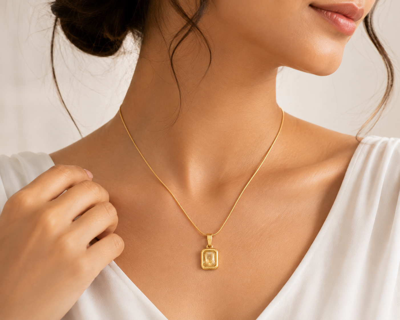Gold bezel champagne crystal rectangle pendant necklace in open black velvet luxury gift box with gold bow on black satin – elegant statement necklace gift for her