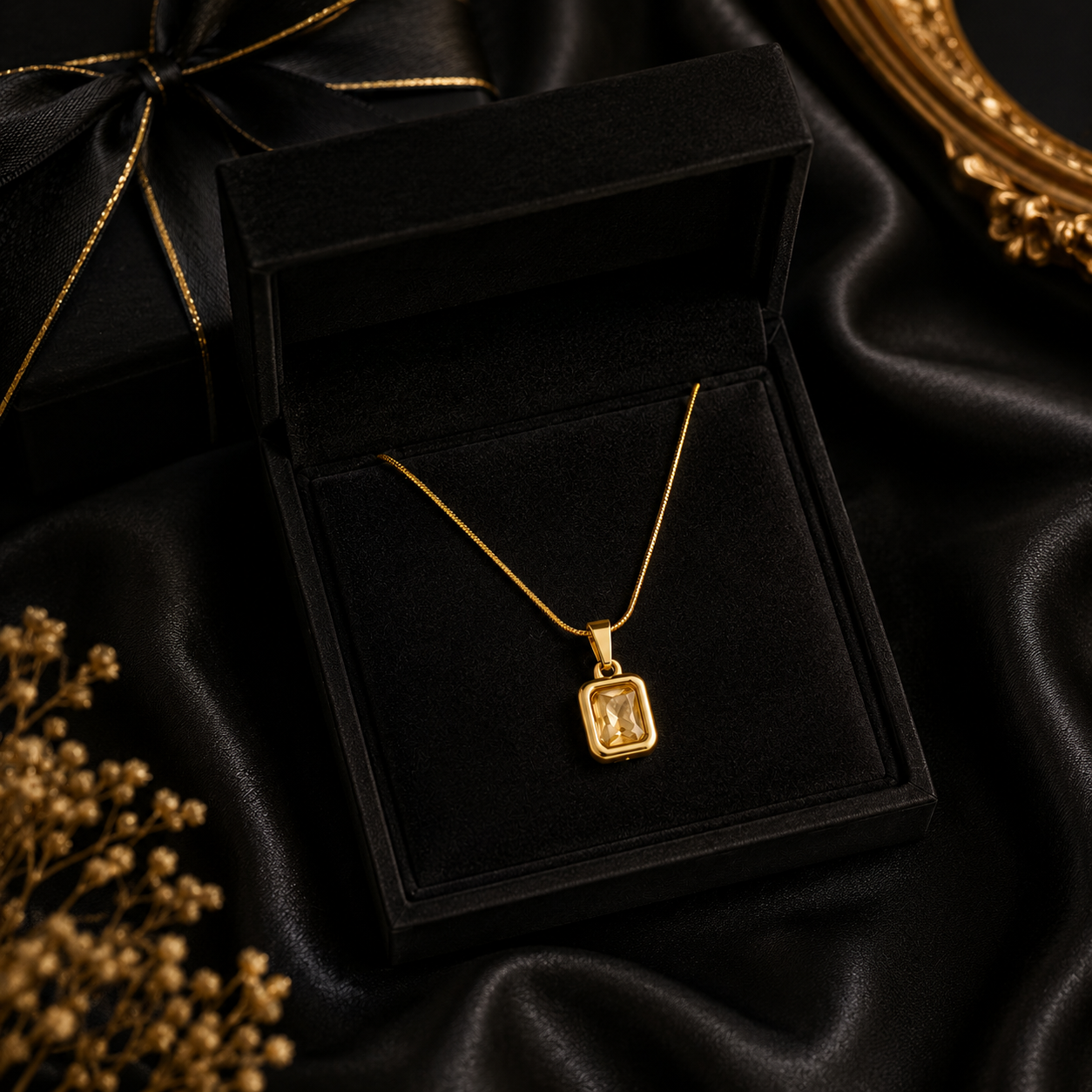 Gold champagne crystal rectangle pendant necklace on navy velvet jewelry bust with pink and purple roses and candlelight – formal occasion evening wear jewelry UAE Australia