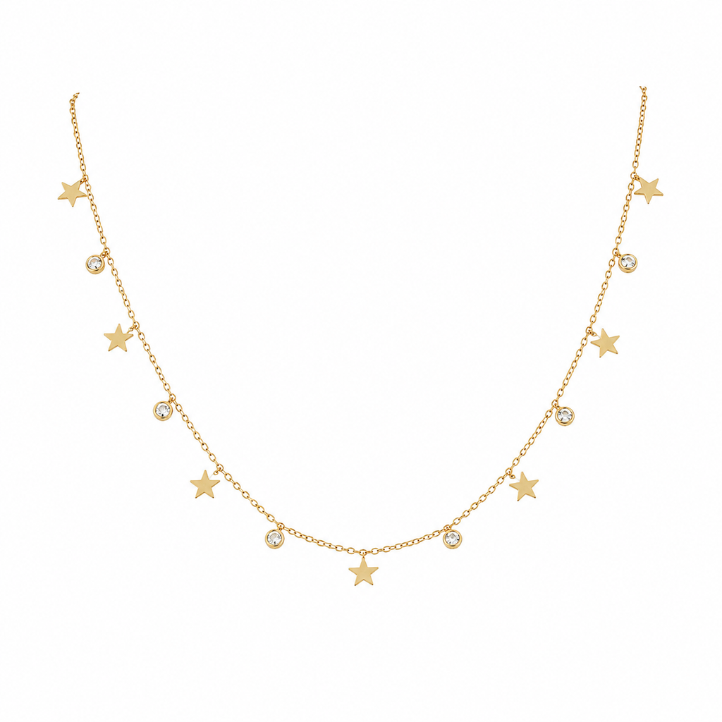 Gold star and CZ crystal charm dangle necklace flatlay on cream satin with dried baby's breath and gold ornate mirror – celestial star necklace gold gift for her AureliaBlends