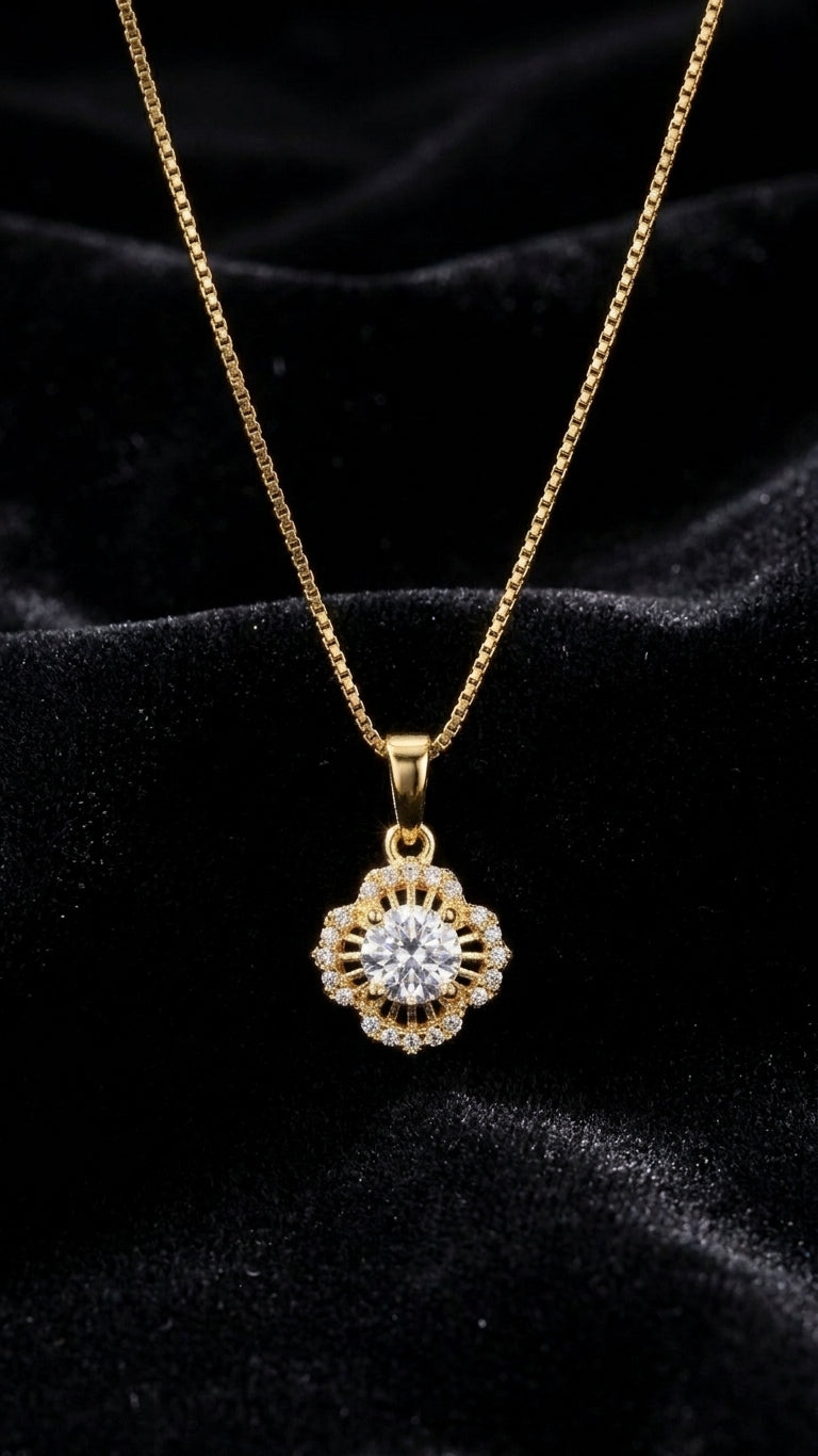 Gold floral sunburst CZ halo pendant necklace displayed on cream velvet jewelry bust in luxury jewellery boutique with glass display cases and warm lighting – wedding guest necklace USA UK Australia