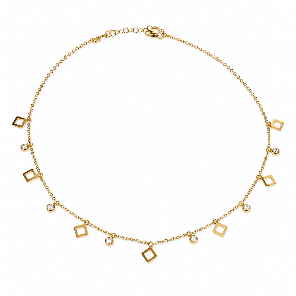 Gold geometric open square and CZ bezel charm dangle necklace flatlay on cream satin with dried baby's breath, beige gift box and crystal perfume bottle – dainty gold geometric necklace AureliaBlends