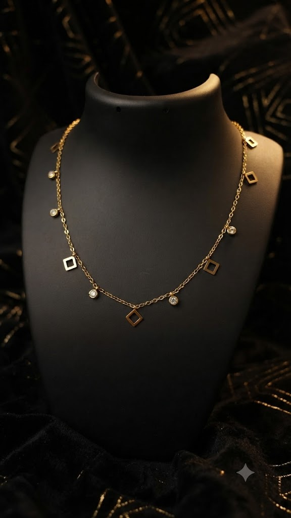 Gold open square and CZ bezel charm dangle necklace displayed on black velvet jewelry bust in luxury jewellery boutique with glass display cases and dark red roses – wedding guest necklace USA UK