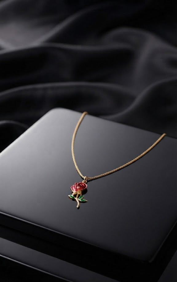 Close-up of gold red rose enamel pendant with green enamel leaves on gold snake chain – romantic rose necklace by AureliaBlends