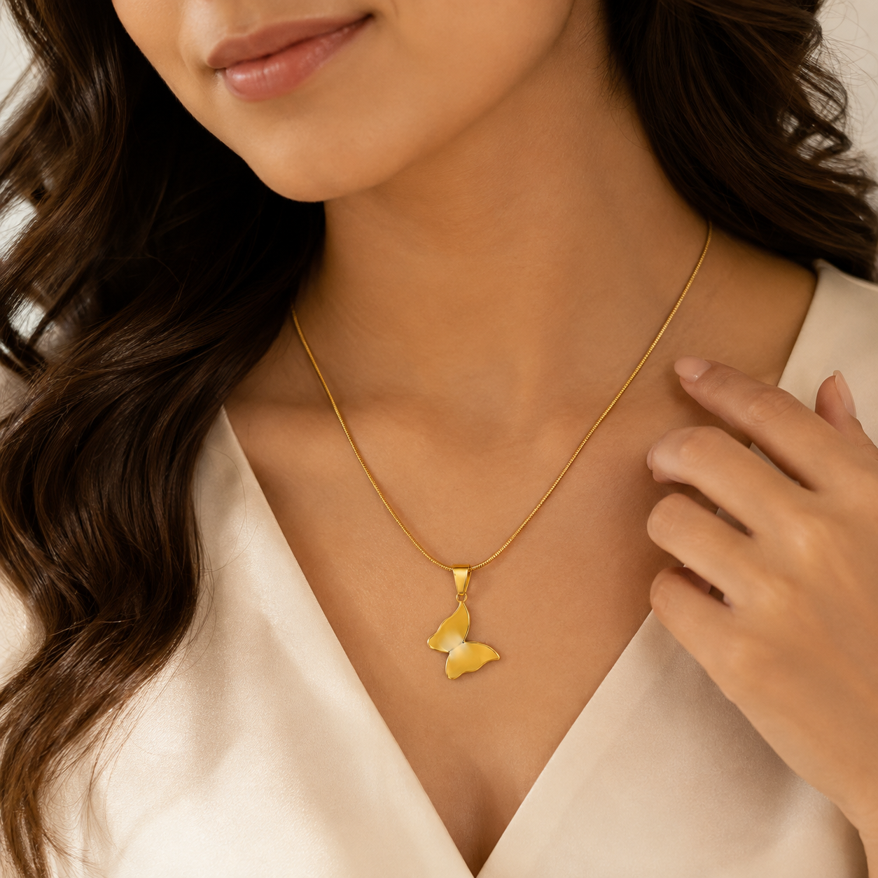 Gold butterfly pendant necklace on black jewellery box with black satin and gold ornate frame – minimalist gold necklace by AureliaBlends