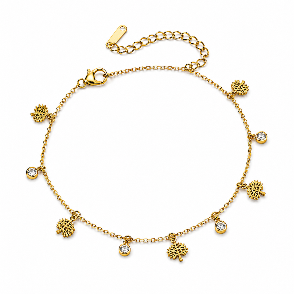 Gold Tree of Life and cubic zirconia CZ charm bracelet worn on wrist against cream satin with baby’s breath – dainty 18K gold-plated charm bracelet by AureliaBlends