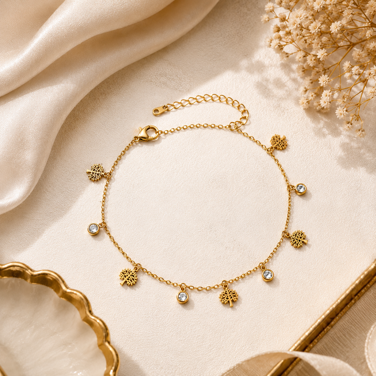 Gold Tree of Life CZ charm bracelet on black velvet tray with gold ornate frame and dried flowers – luxury gold charm bracelet by AureliaBlends