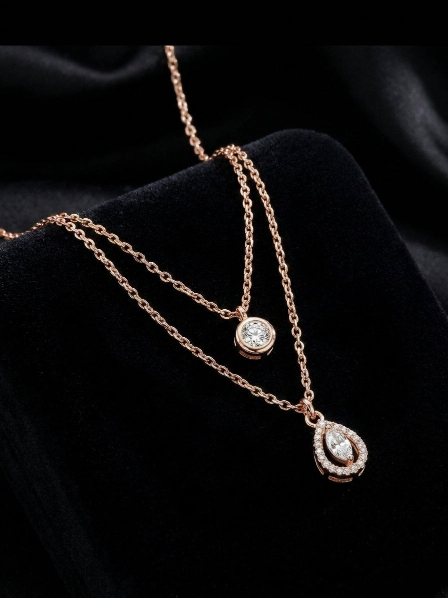 Rose gold double layer CZ solitaire and marquise teardrop halo pendant necklace flat lay on white background showing full chain detail – AureliaBlends