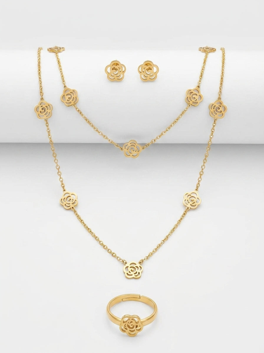 Gold filigree rose 4-piece jewellery set in navy blue velvet gift box with gold ribbon and To My Love card on wooden table with rose petals – romantic gift set by AureliaBlends