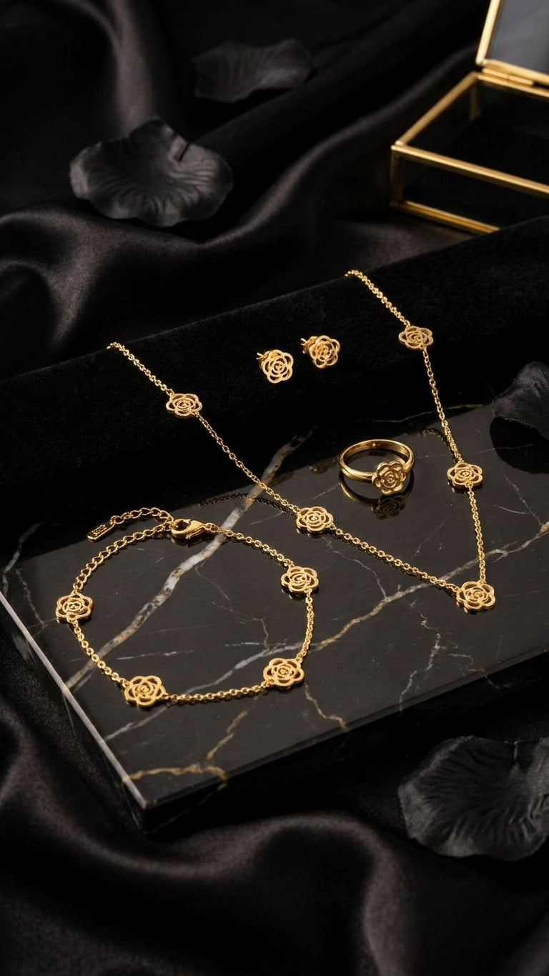 Gold filigree rose jewellery set in emerald green velvet gift box with orchids, tulips and colourful gemstones on vibrant silk fabric – luxury gold rose set UAE gift AureliaBlends