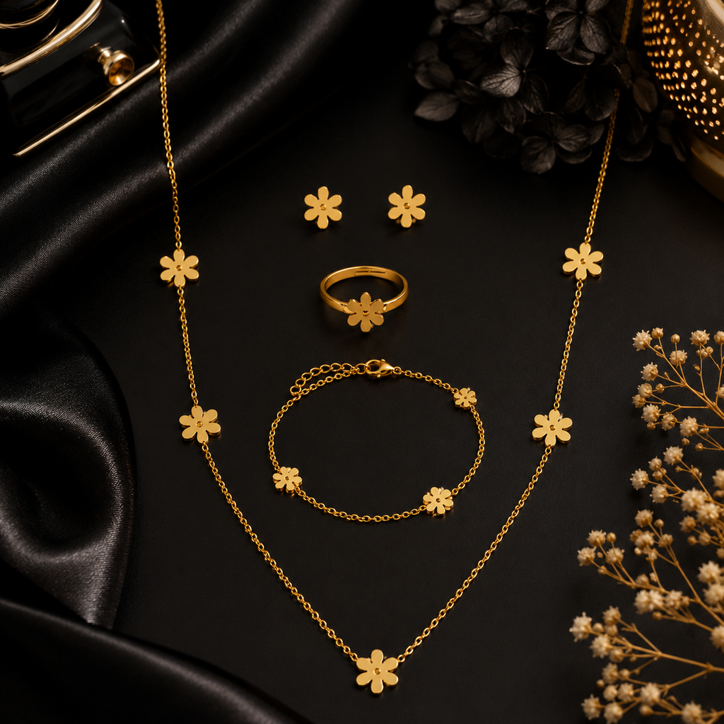Gold daisy flower jewellery set displayed on beige velvet jewellery bust and tray in luxury jewellery store with pink roses – premium gold daisy set AureliaBlends