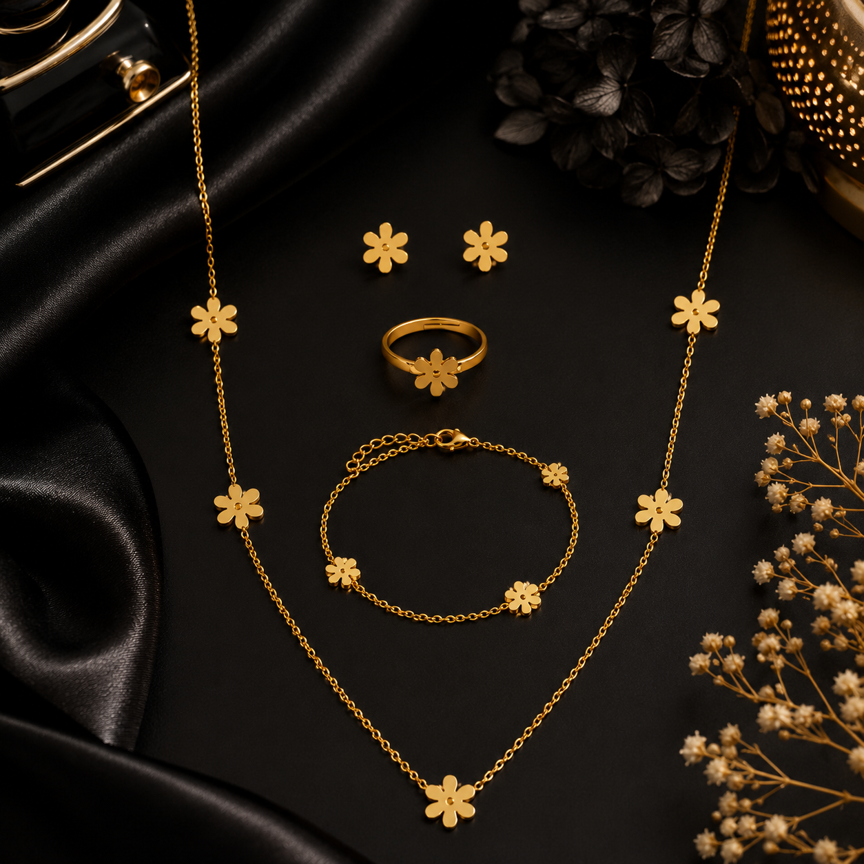 Gold daisy flower jewellery set displayed on beige velvet jewellery bust and tray in luxury jewellery store with pink roses – premium gold daisy set AureliaBlends
