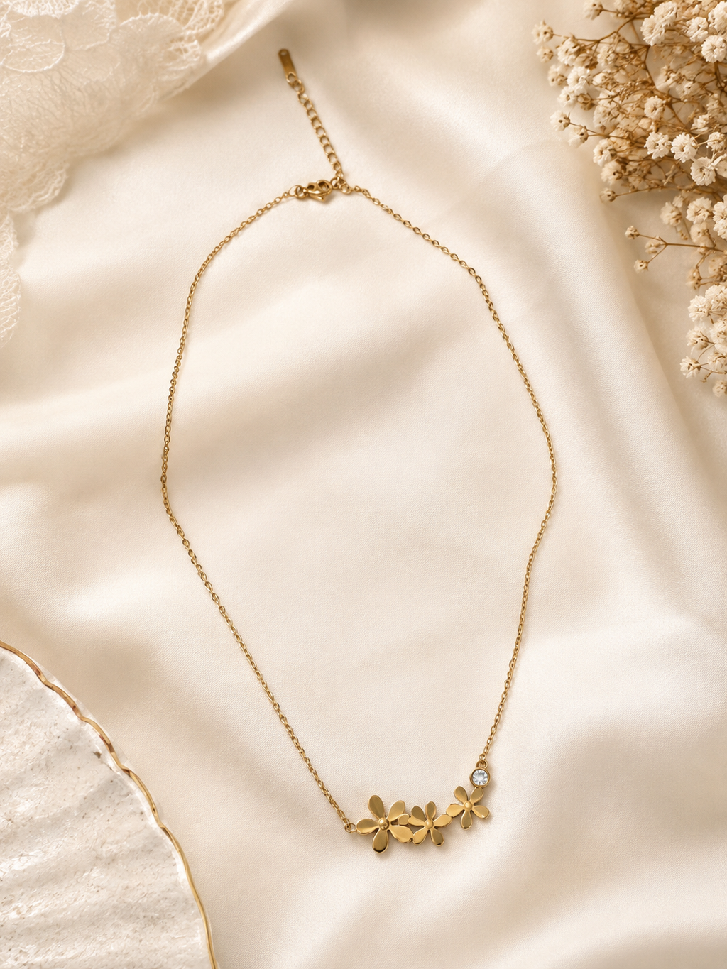 Gold triple daisy flower and CZ pendant necklace in open beige velvet gift box with gold satin ribbon bow on black velvet with dried botanicals – birthday gift necklace for her AureliaBlends