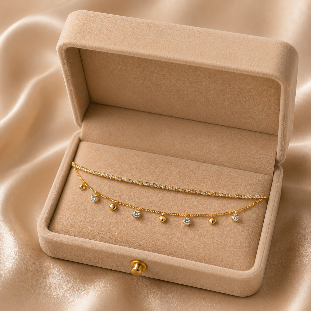 Gold double layer CZ tennis necklace and curb chain with CZ bezel and gold pyramid charm dangles displayed on Fashion Jewelry card in open beige gift box with A Special Gift For You card and gold ribbon on cream satin – AureliaBlends