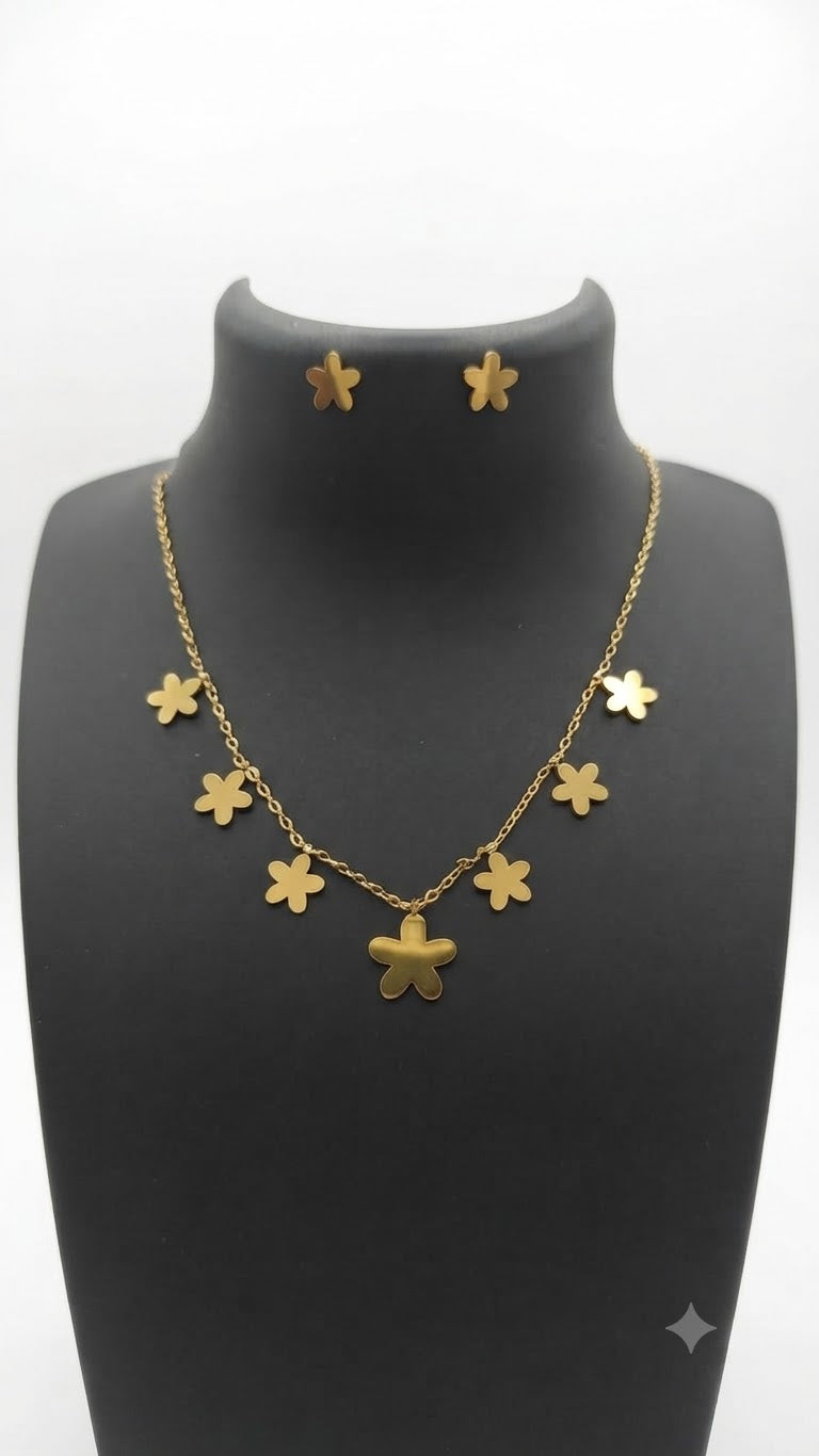 Gold flower necklace and earrings set in blue velvet luxury jewelry box – Aurora Fine Jewels