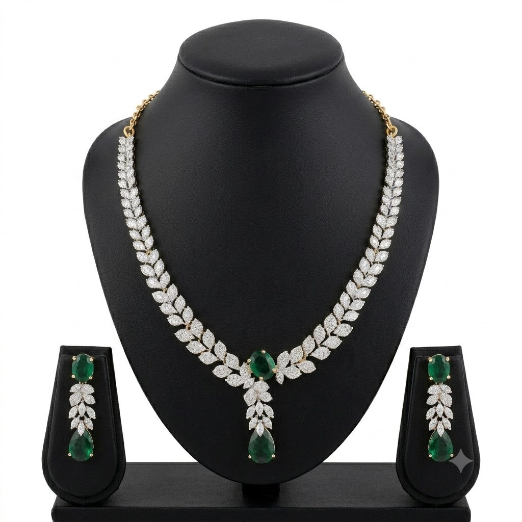 Gold-plated emerald green CZ crystal leaf necklace and drop earrings bridal set on black jewelry bust – AureliaBlends