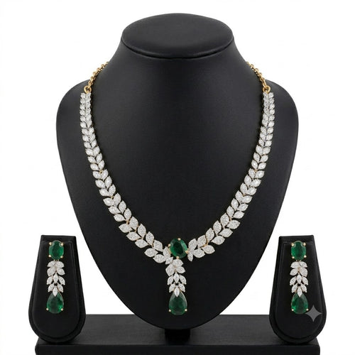 Gold-plated emerald green CZ crystal leaf necklace and drop earrings bridal set on black jewelry bust – AureliaBlends