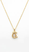 Gold CZ dolphin pendant necklace on cream satin flat lay with teal velvet gift box, vintage gold hand mirror and white orchids – AureliaBlends Ocean Soul Collection