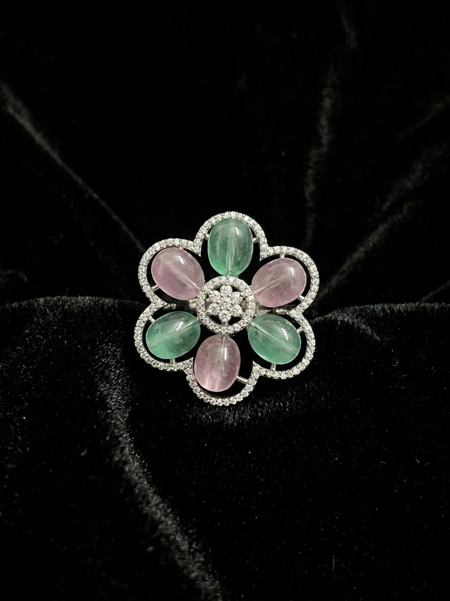 Green aventurine and pink rose quartz floral statement cocktail ring in silver CZ scalloped setting product shot on black velvet background showing full bloom flower design – AureliaBlends