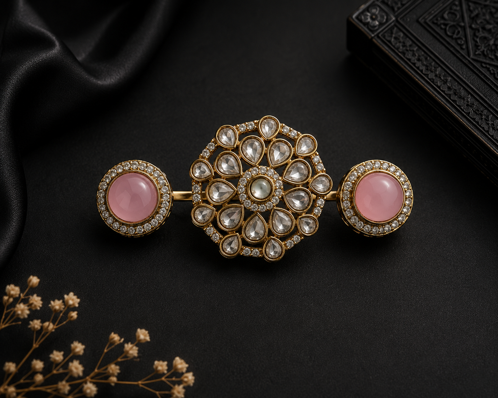 Gold Kundan double finger ring with green cabochon side stones and polki crystal floral centrepiece displayed in open cream velvet luxury jewelry box on dark background – AureliaBlends