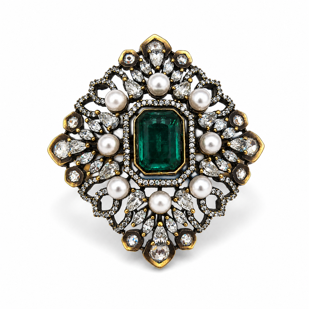 Antique gold Mughal filigree cocktail ring with emerald green emerald-cut centre stone pearl cabochons and pear CZ stones product shot on white background showing full diamond-shaped filigree design – AureliaBlends