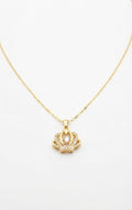 Gold CZ open crown pendant necklace on cream linen flat lay with navy velvet monogram gift box, lavender sprigs, navy silk scarf and fountain pen – AureliaBlends To My Queen Collection lifestyle shot
