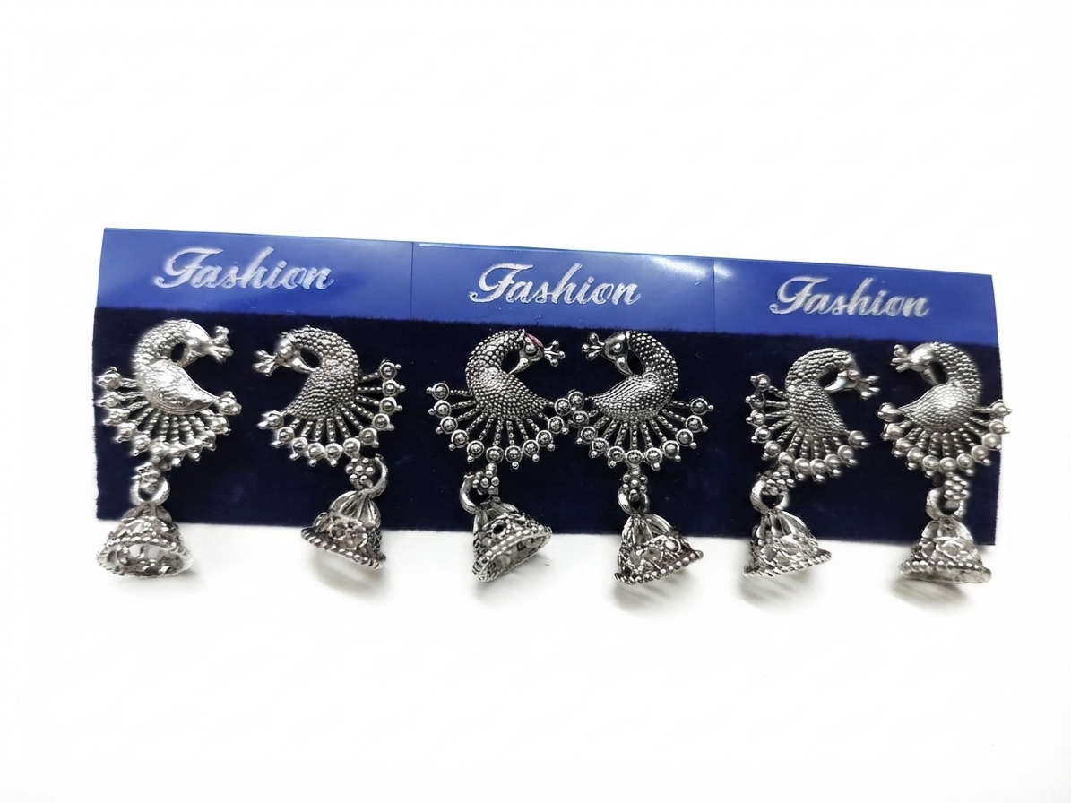 Oxidized silver peacock jhumka earrings displayed on burgundy velvet with pearls and gold beads – AureliaBlends