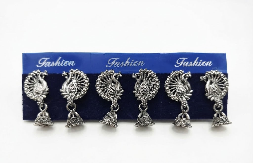 Oxidized silver peacock jhumka earrings on blue fashion card with gift box, eucalyptus and pearl styling – AureliaBlends