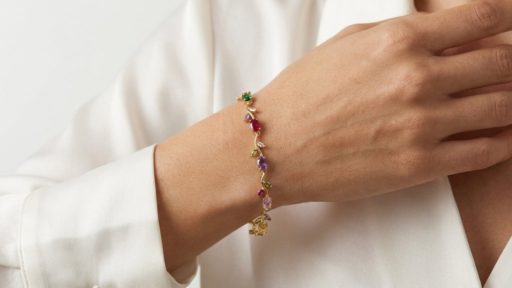 Gold-plated rainbow gemstone CZ floral vine bracelet flat lay on cream silk with crystal quartz and gypsophila – AureliaBlends