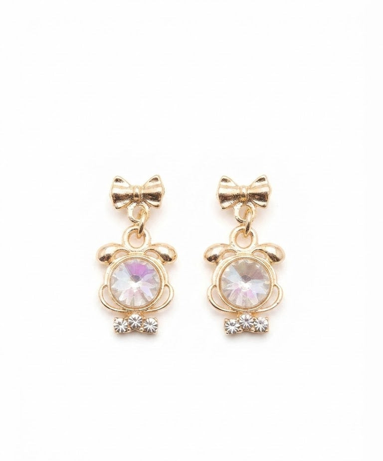 Gold-plated bow stud and smoky crystal drop earrings with CZ accents displayed in cream velvet jewellery box on black marble – AureliaBlends