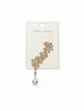 A gold-toned dangle earring with clear rhinestones arranged in a leaf-like cluster, hanging from a white display card labeled 'Fashion Jewelry' on a white background.