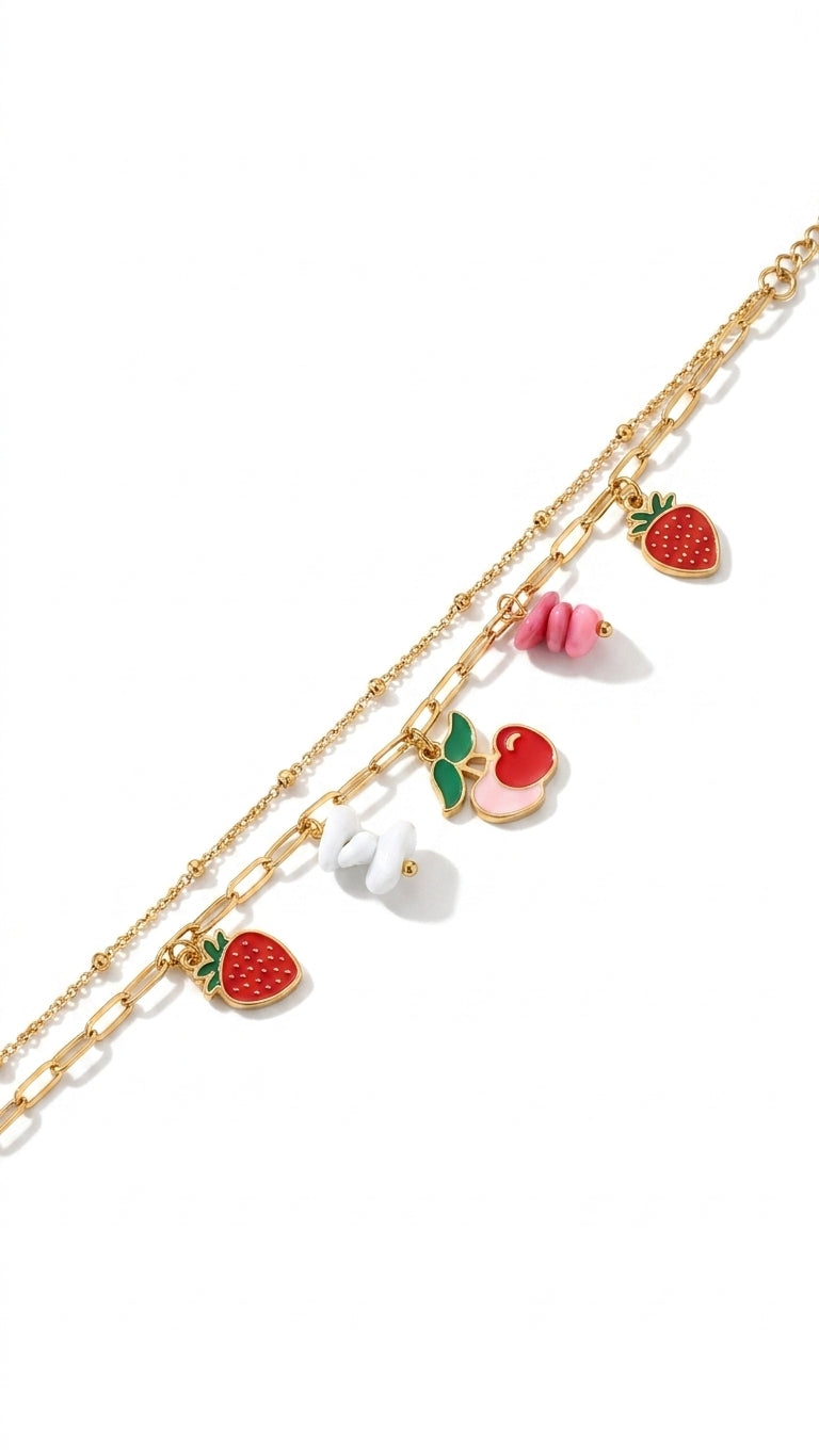 Gold-plated double layer fruit charm anklet with strawberry, cherry, bunny and pink bead charms on black marble with black ribbon – AureliaBlends