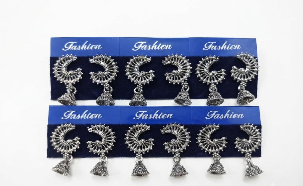 Six pairs of oxidized silver crescent peacock jhumka earrings on blue fashion display cards – handcrafted Indian ethnic fan dangle earrings by AureliaBlends