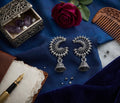 Oxidized silver crescent peacock jhumka earrings flat lay on blue velvet with red rose, amethyst jewelry box, vintage pen and carved wooden comb – AureliaBlends lifestyle