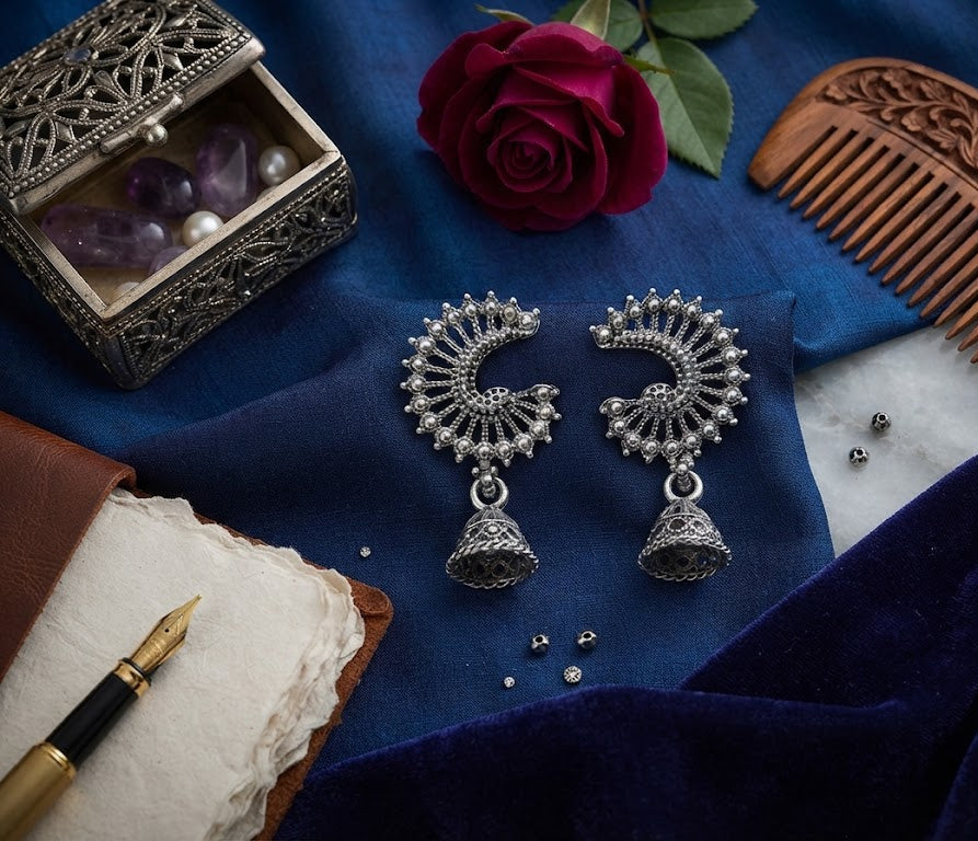 Oxidized silver crescent peacock jhumka earrings flat lay on blue velvet with red rose, amethyst jewelry box, vintage pen and carved wooden comb – AureliaBlends lifestyle