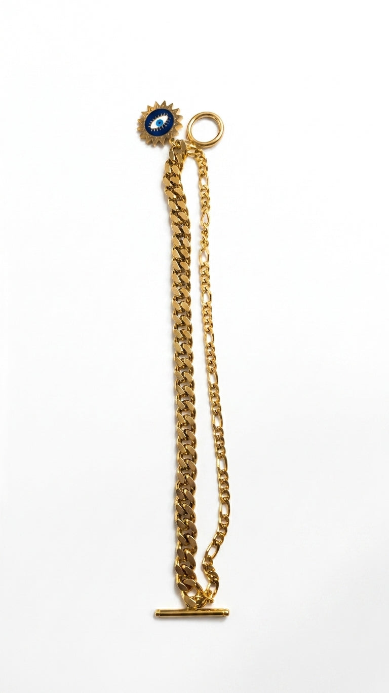 Woman wearing gold-plated evil eye dual chain charm bracelet with toggle clasp on wrist – AureliaBlends