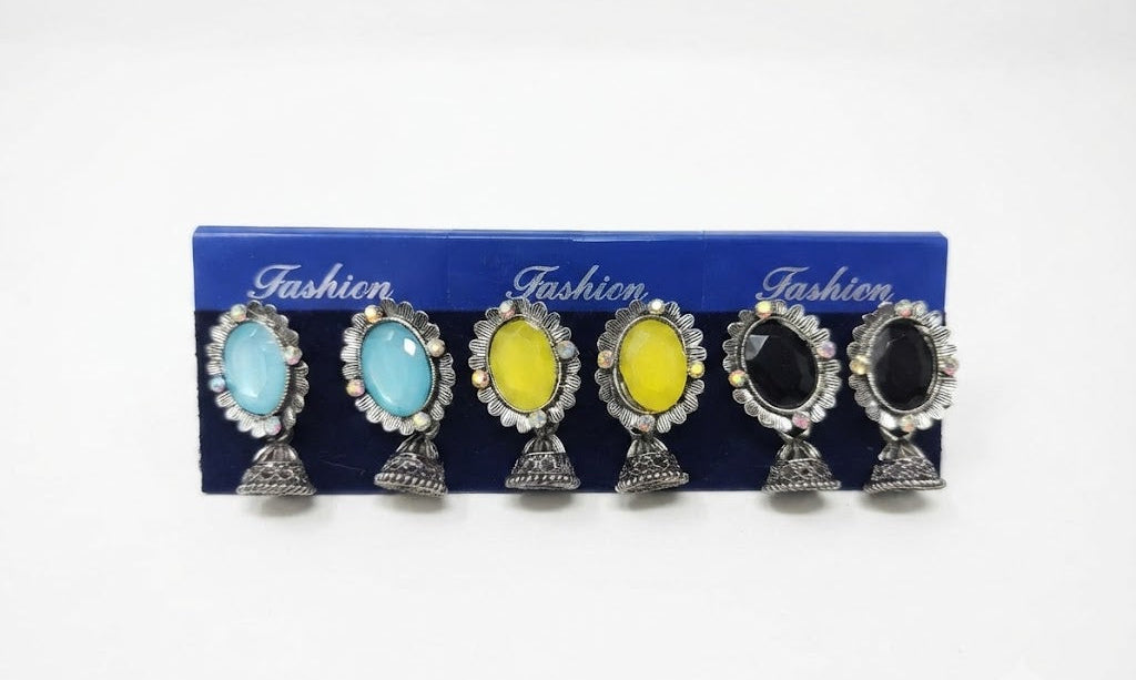 Oxidized silver oval gemstone jhumka earrings in 6 colors – aqua blue, yellow, black, red, green, purple on navy fashion display card by AureliaBlends