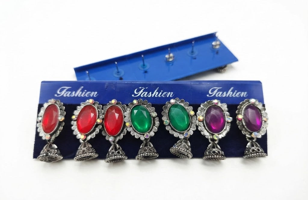 12 pairs of oxidized silver oval gemstone jhumka earrings in luxury navy blue velvet collector's display box – multicolor Indian ethnic earrings AureliaBlends