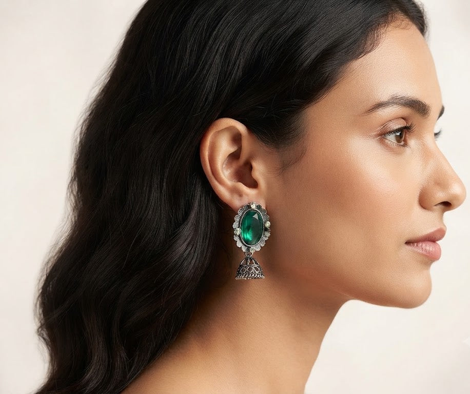 Oxidized silver oval gemstone jhumka earrings in red, emerald green and purple – three color variants on navy fashion display card AureliaBlends