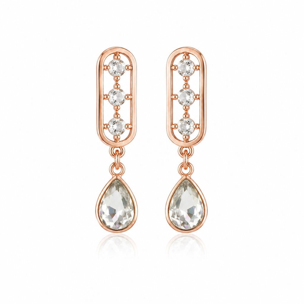 Model wearing rose gold CZ oval bar and teardrop crystal drop earrings with sleek updo – AureliaBlends bridal dangle earrings