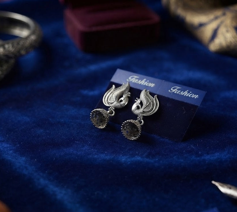 Three pairs of oxidized silver phoenix bird jhumka earrings in luxury wooden gift box with navy blue velvet lining and 'With Love For You' inscription – AureliaBlends